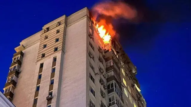 A handout photo made available by the Kyiv City Military Administration of a fire at an apartment building after being damaged during a drone strike in Kyiv (Kiev), Ukraine, 30 May 2023, amid the Russian invasion