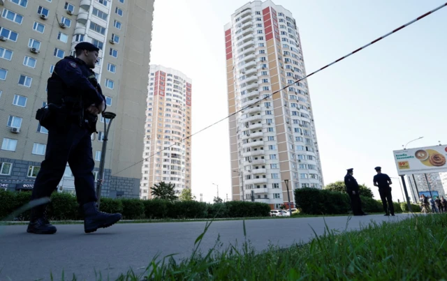 An officer stands within a cordon in Moscow