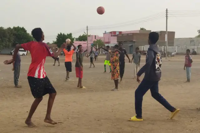 Youths play football on a makeshift pitch in Wad Madani, the capital of al-Jazirah state in war-torn Sudan - 30 May 2023