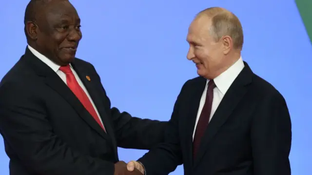 Russian President Vladimir Putin (R) greets South African President Cyril Ramaphosa (L) during the welcoming ceremony at the Russia-Africa Summit in Black Sea resort of Sochi, Russia, October 23, 2019
