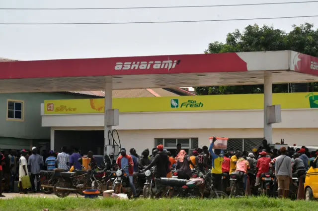 Motorbike taxis converge to buy fuel at a petrol station at Ibafo, Ogun State in south-west Nigeria - 30 May 2023