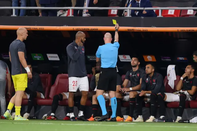 Anthony Taylor books a player on the bench for Sevilla