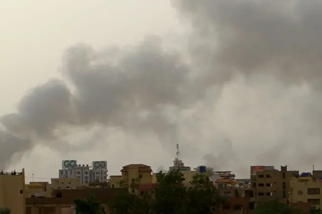 Smoke billows over buildings in southern Khartoum on May 29, 2023, amid ongoing fighting between the forces of two rival generals.