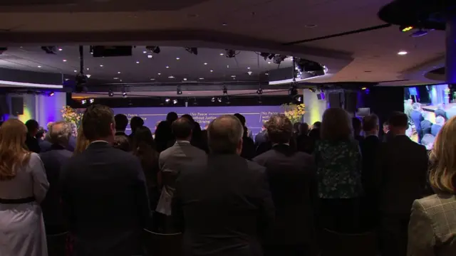 People stand for a minute's silence in The Hague