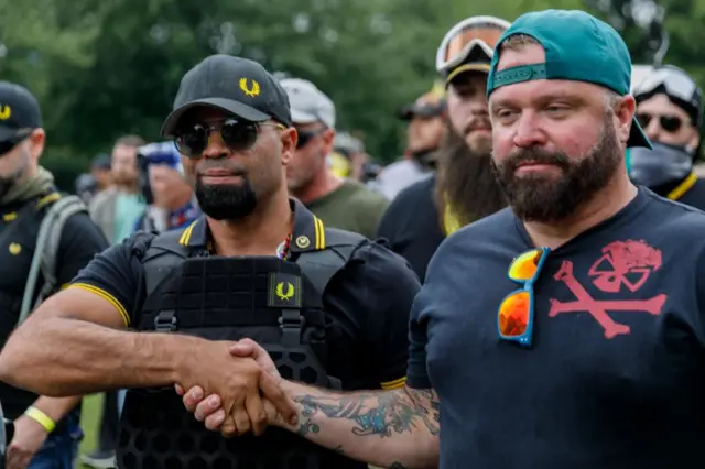 Henry "Enrique" Tarrio and Joe Biggs shaking hands