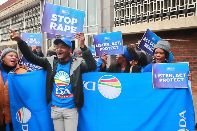 Democratic Alliance members outside Krugersdorp Magistrate's Court on August 03, 2022 in Krugersdorp, South Africa.