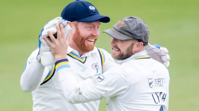 Jonny Bairstow celebrates a catch with Adam Lyth