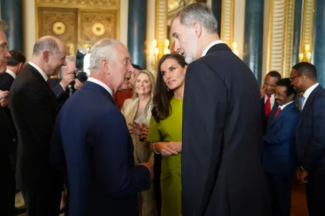 The King chatting with King Felipe VI and Queen Letizia of Spain