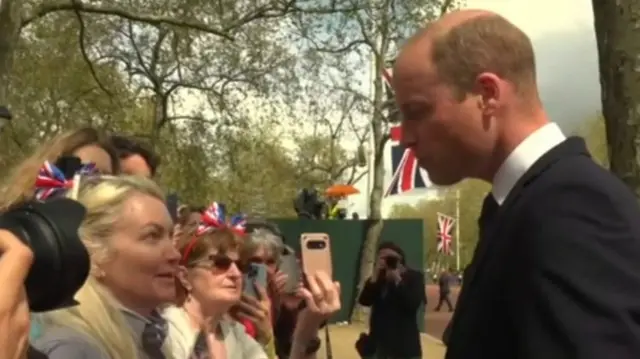 The Prince of Wales speaks to a woman from Phoenix, US
