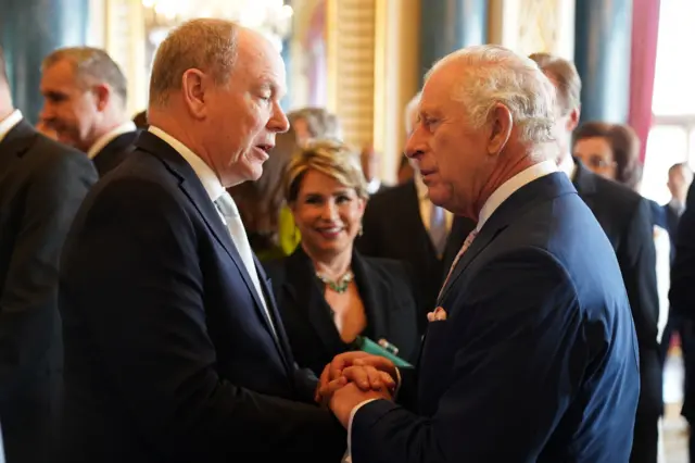 Prince Albert II of Monaco greets the King