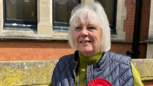 Councillor with Labour rosette for East Staffs Borough Council, King Edward Place, Burton upon Trent,