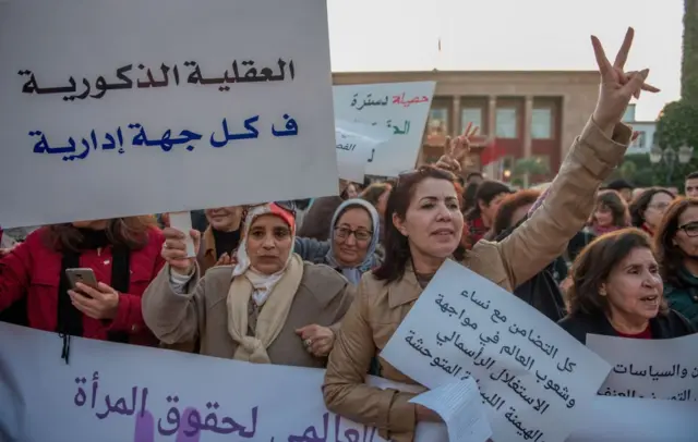 Women hold banners during a protest on 'violence against women' regarding the International Women's Day in front of Parliament Building in Rabat, Morocco on March 08, 2018.