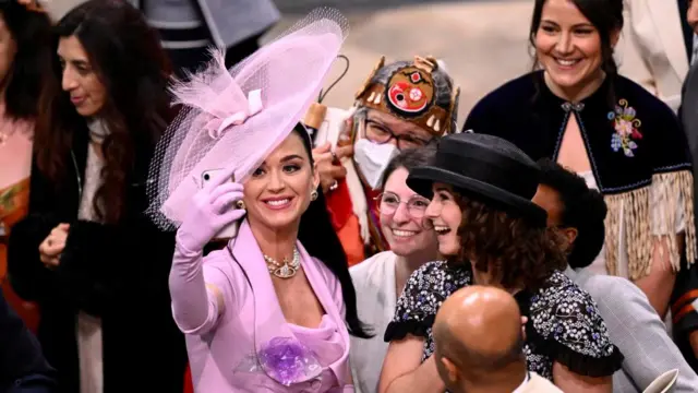 Katy Perry takes selfies with guests