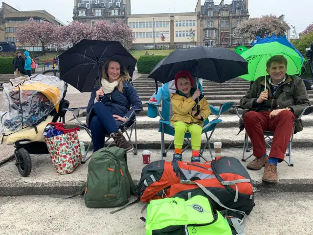 These early birds braved the early morning rain to secure a prime spot in Edinburgh's Princes Street Gardens.