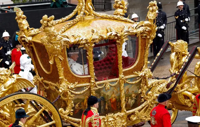 King Charles travels in the Gold State Coach following the coronation ceremony