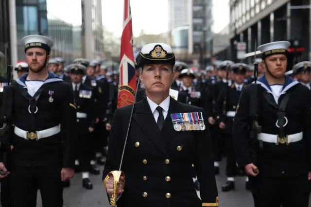 Royal Navy contingent marching across Westminster Bridge