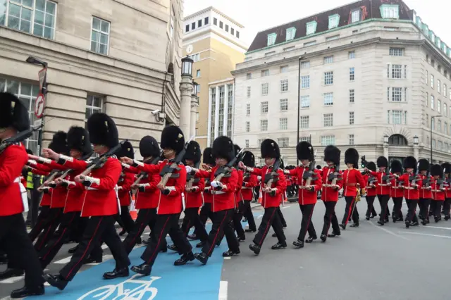 Troops in full military uniform leave Waterloo station