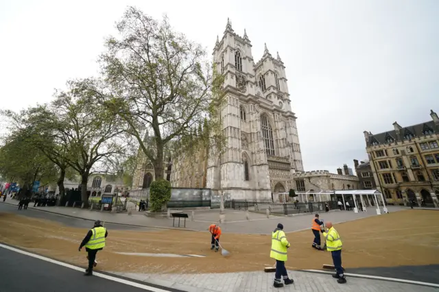 People in hi-vis jackets outside Westminster Abbey