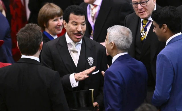 Singer Lionel Ritchie shares a joke with Mayor of London Sadiq Khan