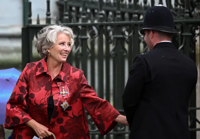 Emma Thompson walks outside Westminster Abbey following King Charles' coronation ceremony.