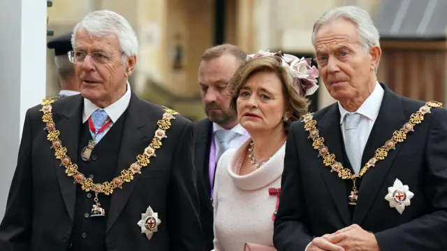 Former prime ministers John Major and Tony Blair with his wife Cherie