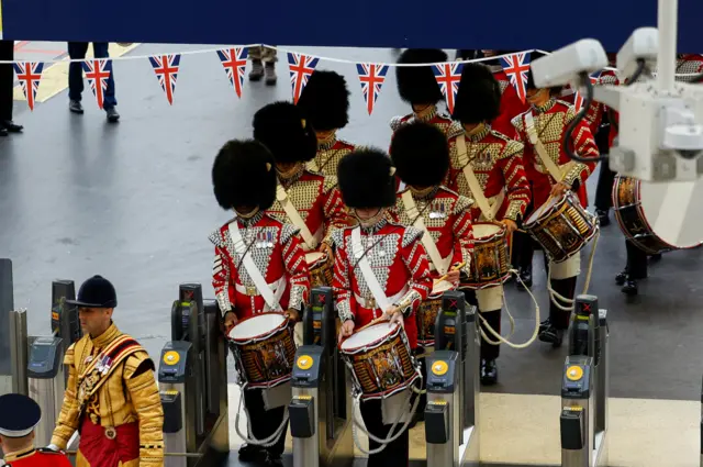 Troops in full military uniform arrive at Waterloo train station