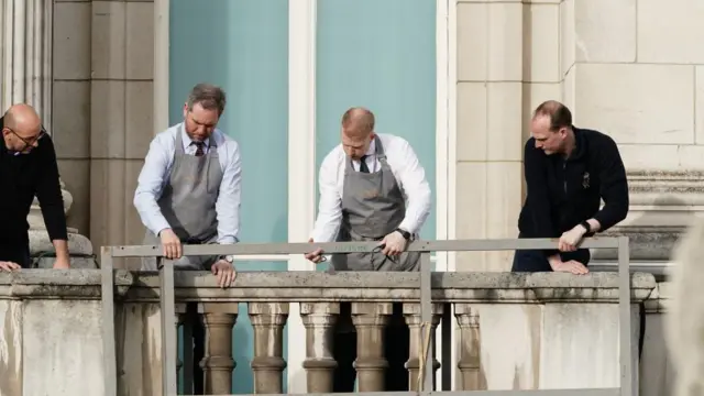 People cleaning balcony