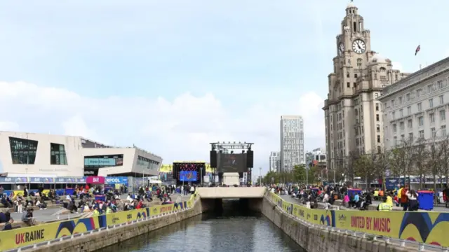 A sunny scene in Liverpool as people watch the Coronation in public