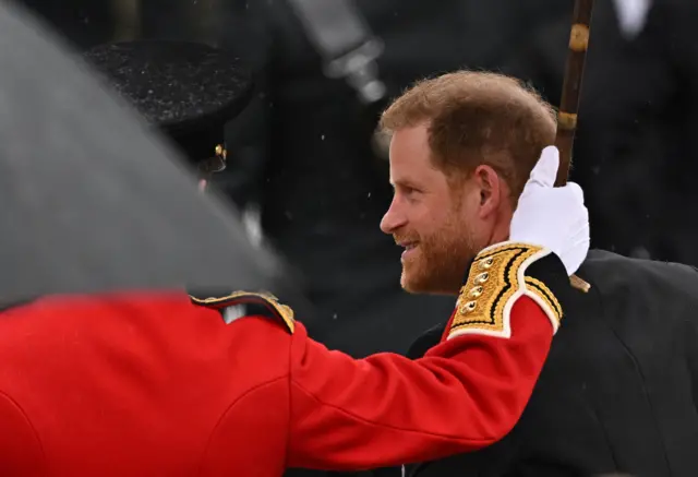 Britain's Prince Harry, Duke of Sussex, walks outside Westminster Abbey