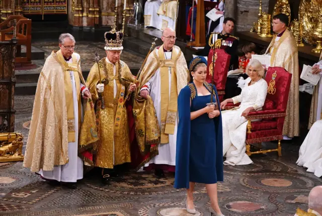 Penny Mordaunt holding the sword during the ceremony