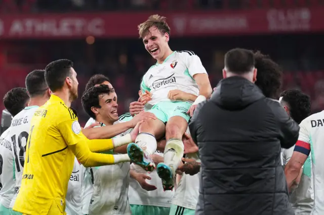 Pablo Ibanez of CA Osasuna is lifted by teammates in celebration following the Copa Del Rey Semi Final Second Leg match between Athletic Club and Osasuna at Estadio de San Mames on April 04, 2023 in Bilbao, Spain