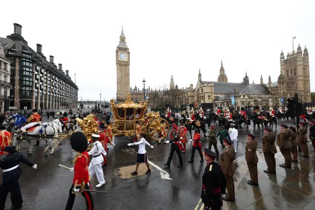 King Charles and Queen Camilla travel in a coach past Big Ben