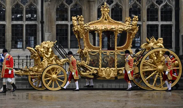 The Gold State Coach is seen outside the Westminster Abbey