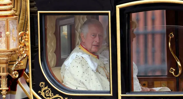 The Diamond Jubilee Coach carries Britain's King Charles and Queen Camilla