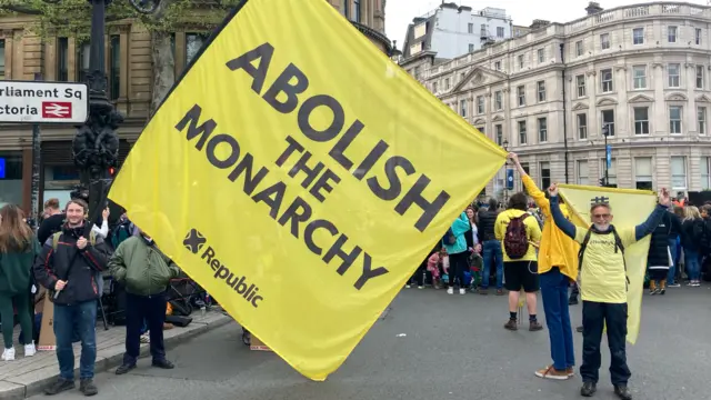 A small group of anti-monarchy protestors has arrived at Trafalgar Square.