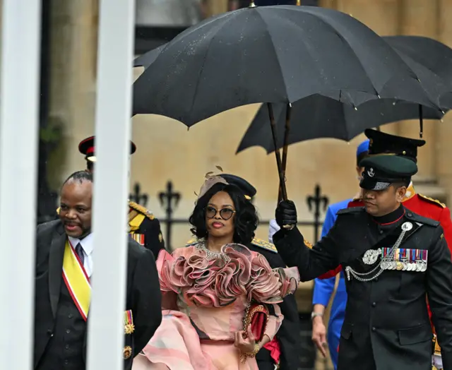 King Mswati III of Eswatini and Queen LaMbikiza under an umbrella - 6 May 2023