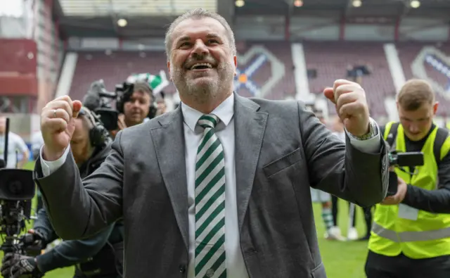 Ange Postecoglou beams as he celebrates his second league title