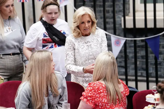 Jill Biden (centre) speaks to guests at Downing Street's Big Lunch