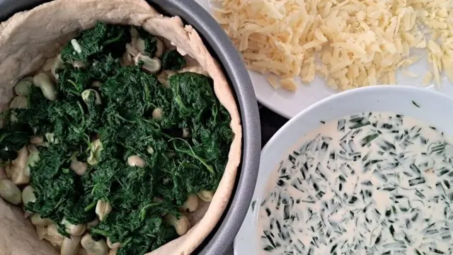 The ingredients of the Coronation Quiche, namely spinach, broad beans, pastry, cream, tarragon and cheese.