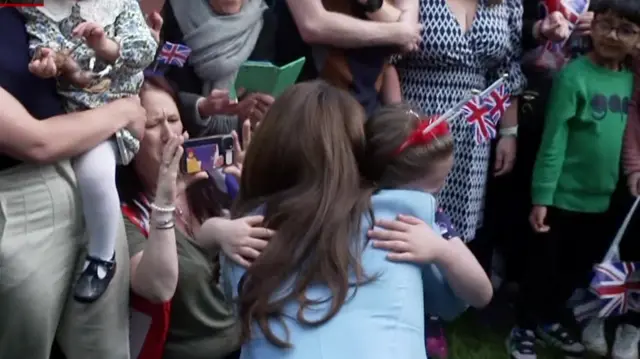 Kate hugs a child in Windsor