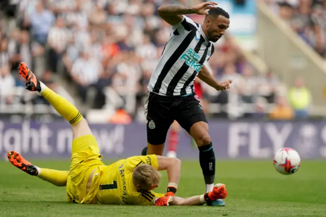 Arsenal’s Aaron Ramsdale (left) challenges Newcastle United’s Callum Wilson