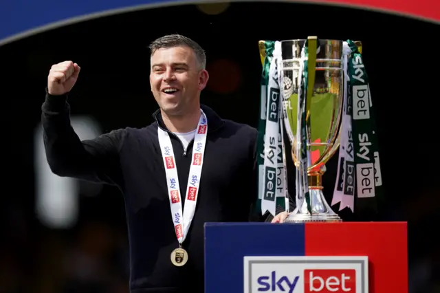 Plymouth boss Steven Schumacher with the League One trophy