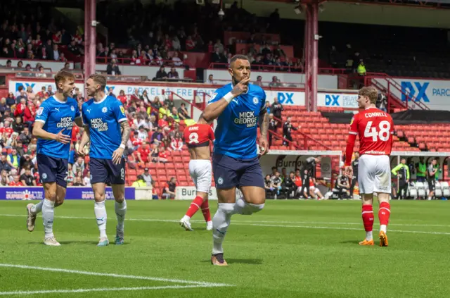 Jonson Clarke-Harris celebrates scoring for Peterborough at Barnsley