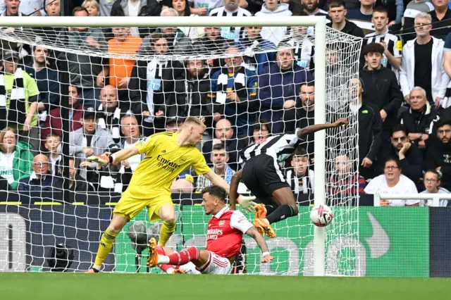 Aaron Ramsdale makes a save against Alexander Isak