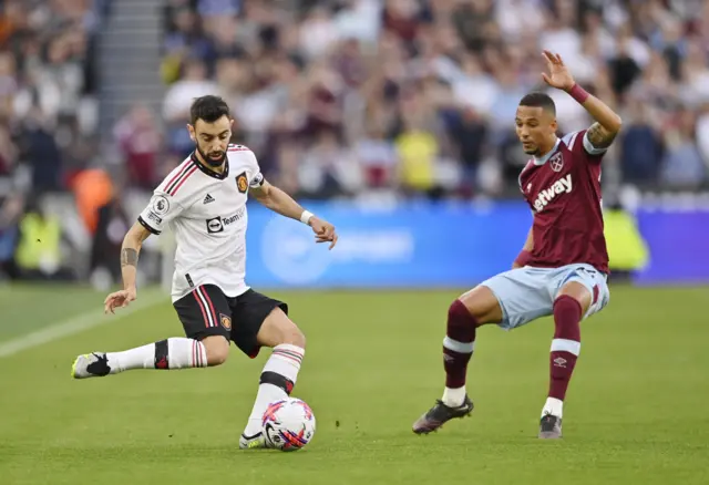 Manchester United's Bruno Fernandes in action with West Ham United's Thilo Kehrer