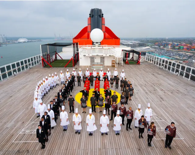 Queen Mary II crew celebrate coronation