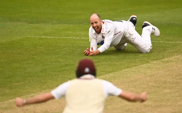 Leach hangs on to a low catch