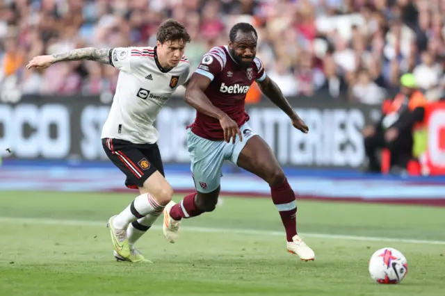 Michail Antonio of West Ham and Victor Lindelof of Manchester United