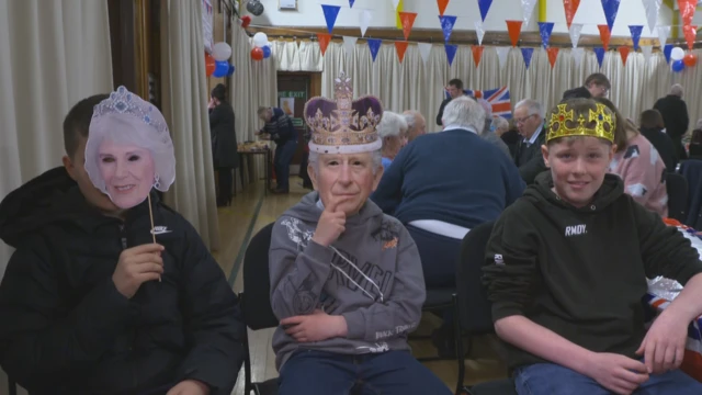 Three boys, two wearing masks