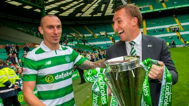 Brendan Rodgers celebrates his maiden title in a record-breaking season